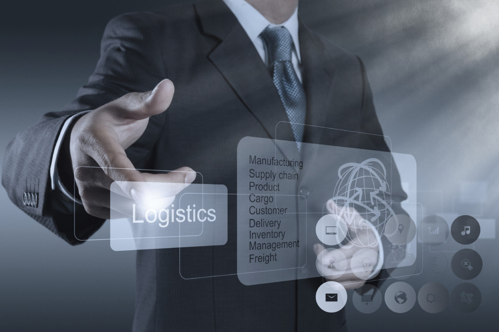 businessman shows logistics diagram as concept